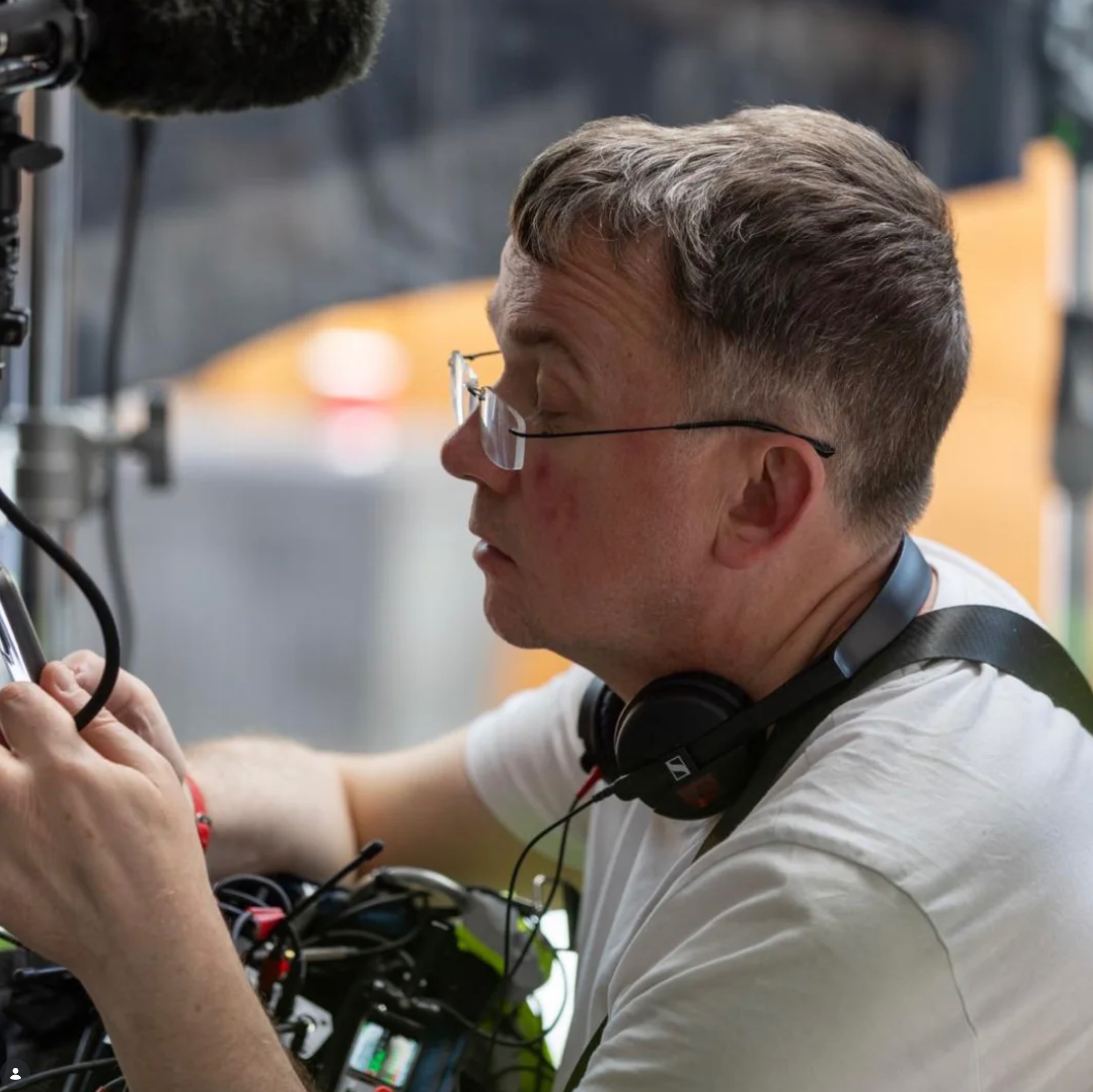 Martin Edwards working with a boom microphone on set
